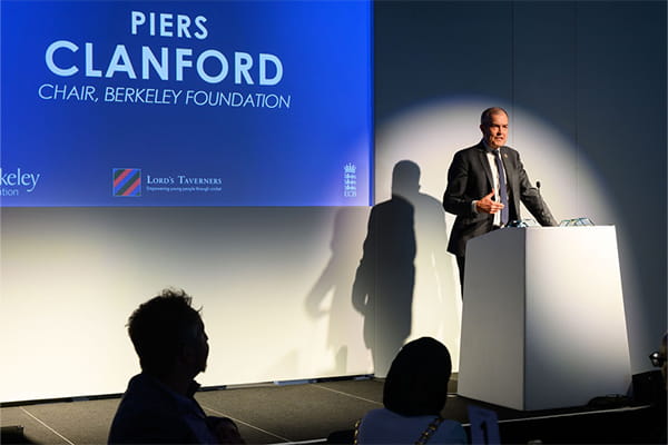 Piers Clanford on stage presenting.