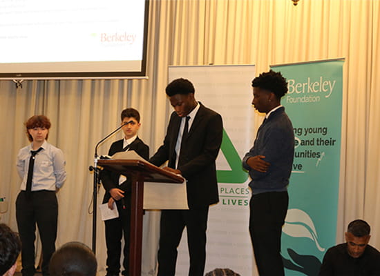 Youths at a speaking rally on stage supported by Berkeley Foundation.