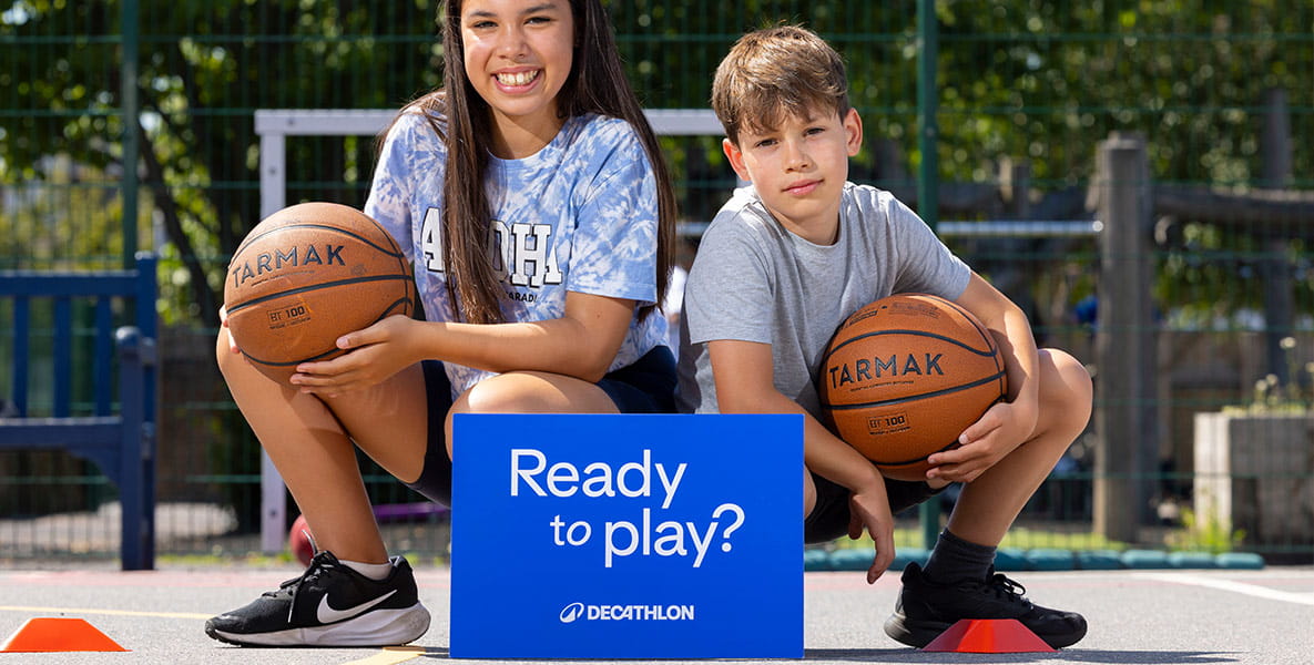 Picture of two children playing basketball