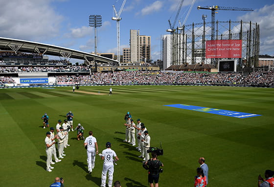 An image of Cricket Players at the Oval filled with Fans