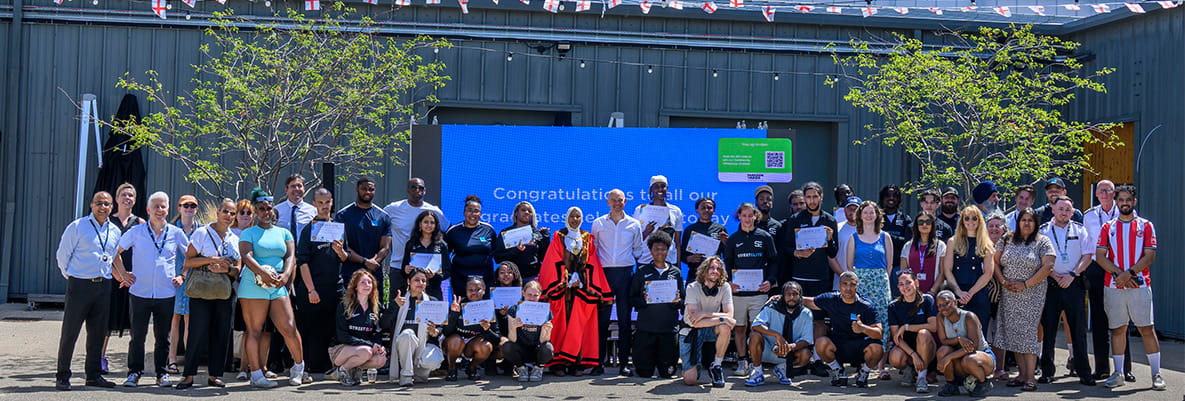 Group photo of participants and representatives for The Green Quarter Street Elite Graduation Ceremony, in Ealing.